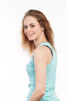 Portrait of a beautiful woman turning around and looking at the camera, isolated on white