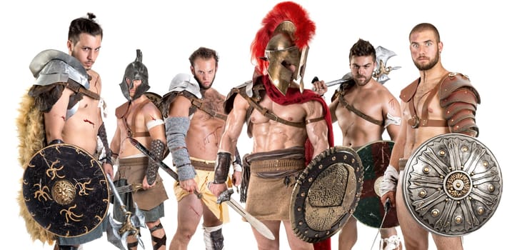 Group of gladiators posing isolated in white
