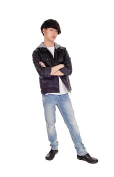 A happy Asian teenager standing in an black jacket crossing his arms,.standing, isolated for white background..