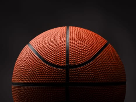 Close up shot of a basketball on a dark background