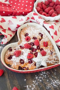 Casserole,cake with fresh raspberries and icing sugar