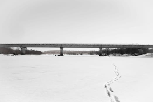 Concrete bridge over the frozen river