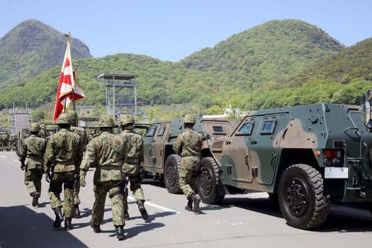 Kagawa, Japan - April 23 2017: Japanese soldier marching orders with the armored vehicle at the Zentuji military base