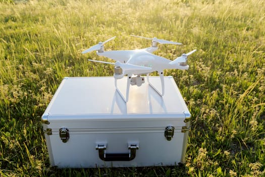 KAGAWA, JAPAN - APRIL 23, 2017: White drone Dji Phantom4Pro stay on metal bag and ready to fly.