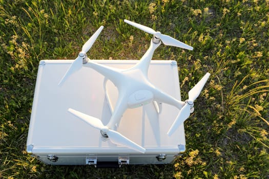 KAGAWA, JAPAN - APRIL 23, 2017: White drone Dji Phantom4Pro stay on metal bag and ready to fly.