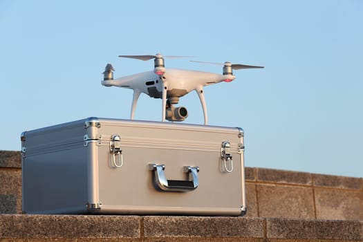 KAGAWA, JAPAN - APRIL 29, 2017: White drone Dji Phantom4Pro on metal bag and ready to fly