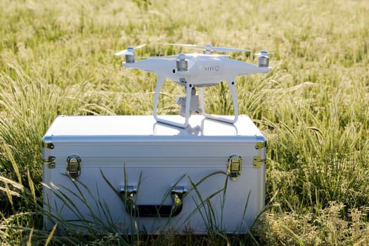 KAGAWA, JAPAN - APRIL 23, 2017: White drone Dji Phantom4Pro stay on metal bag and ready to fly.