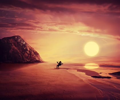 Young man riding a wild horse near the seaside over a hot sunset background. New lands discovery, adventure and friendship concept.