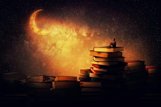 Boy sitting alone on a pile of books, looking a the new moon. Magic night scene. In search of knowlegde concept.