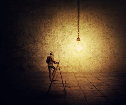 Young boy with a bag on his back, trying to climb a ladder looking for a lightbulb. Idea achievement concept.