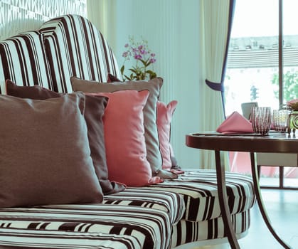 Table and Sofa with pillows, vintage filtered effect image