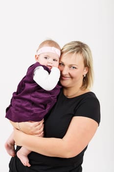 mother with her cute little baby girl, first year of the new life