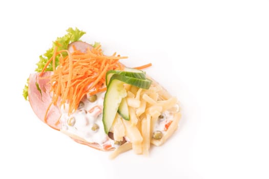 Danish specialties and national dishes, high-quality open sandwich. Sandwich with sliced ham, Mayonnaise with green peas and carrot tart, cracked carrots, asparagus and cucumbers