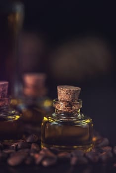 Oil of cedar nuts on a dark wooden background