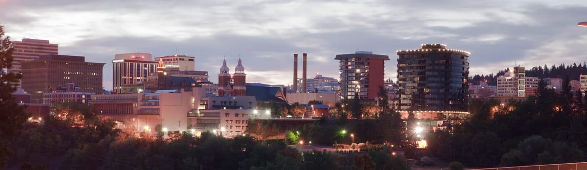The sun rises behind historic Spokane Washington