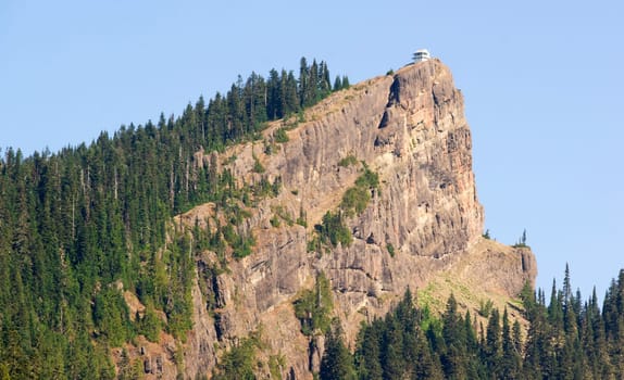 A sharp high ridge holds a historic building used for fire spotting