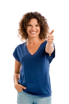 Portrait of a smiling middle aged woman pointing to the camera