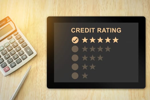 excellent five stars credit rating on tablet with soft light vintage effect