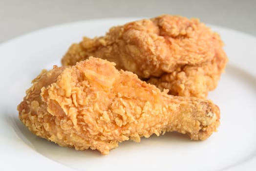 crispy fried chicken in a white plate, selective focus