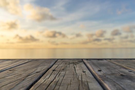 Wooden floor with seascape and sky background