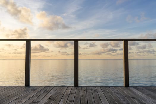 Wooden floor with seascape and sky background
