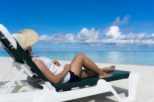 Woman in relaxation on tropical beach in holiday