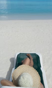 Woman in relaxation on tropical beach in holiday