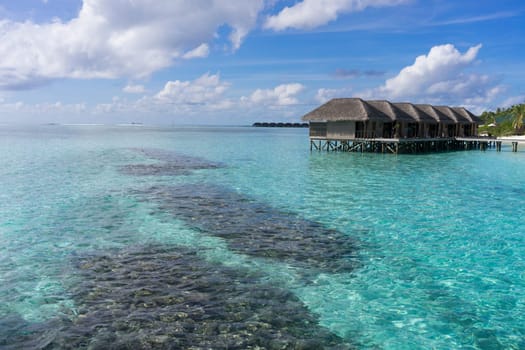 Meeru resort and spa, Maldives - May 8, 2017: Water villas over calm sea in tropical Maldives island