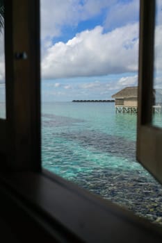 Meeru resort and spa, Maldives - May 8, 2017: Water villas over calm sea in tropical Maldives island