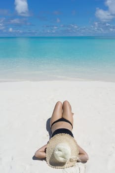 Woman in relaxation on tropical beach in holiday