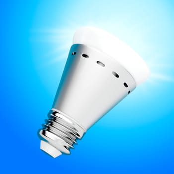 Bright LED light bulb on blue background