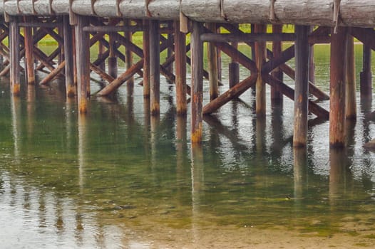 The trestles and their reflections of Fishing Bridge in Yellowstone National Park, Wyoming, USA..
