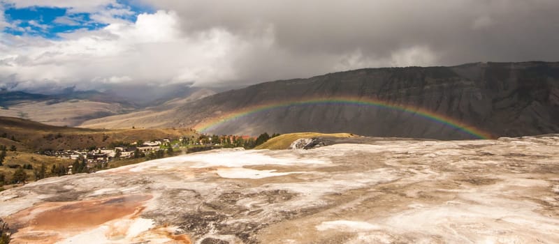 Landscape of a rainbow across Mt. Everts at Mammoth Springs, Wyoming, USA.