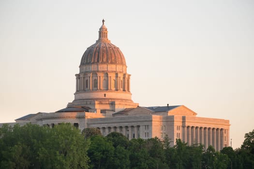The lights come up as the sun fades on the capital building downtown Jefferson City, Missouri
