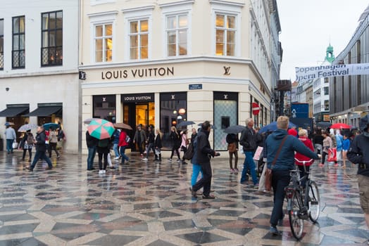 COPENHAGEN, DENMARK - AUGUST 3, 2016: Pedestrian zone in the center of the city on a rainy day