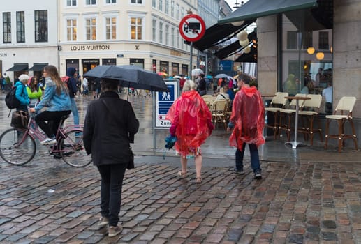 COPENHAGEN, DENMARK - AUGUST 3, 2016: Pedestrian zone in the center of the city on a rainy day