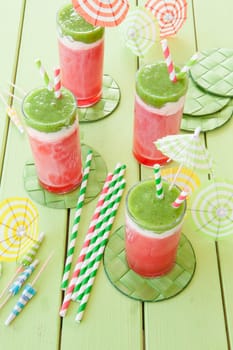Colorful smoothie in glass with watermelon and kiwi