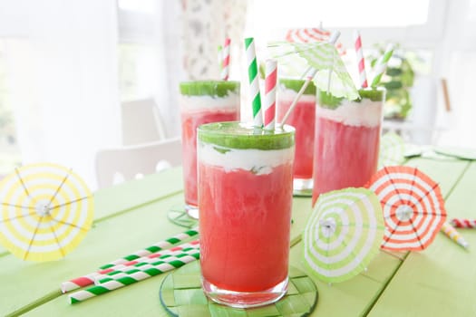 Colorful smoothie in glass with watermelon and kiwi