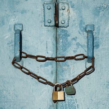 Padlocks on a steel door