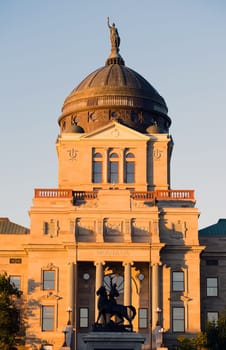 The sun hits the capital building in Helena just after sunrise