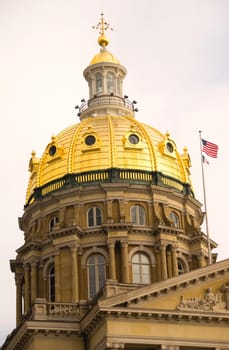 The US and State flags fly at Des Moines Capital