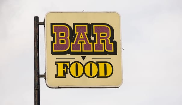 A generic roadside advertisement for a restaurant
