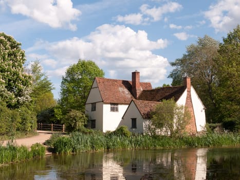 Willy Lott's Cottage outside in flatford mill in constable country old and famous location building from a painting on a summer afternoon with no people very beautiful