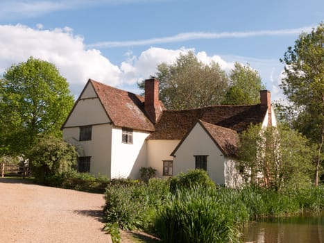 Willy Lott's Cottage outside in flatford mill in constable country old and famous location building from a painting on a summer afternoon with no people very beautiful close up
