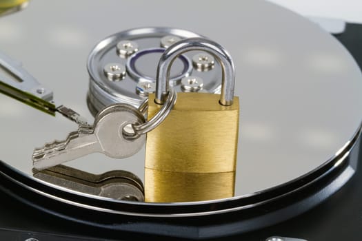 Geo-opened hard drive with small padlock in detail