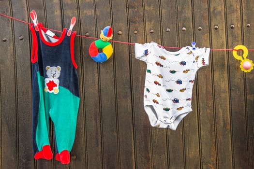 Clothesline with children's things in front of the courtyard gate