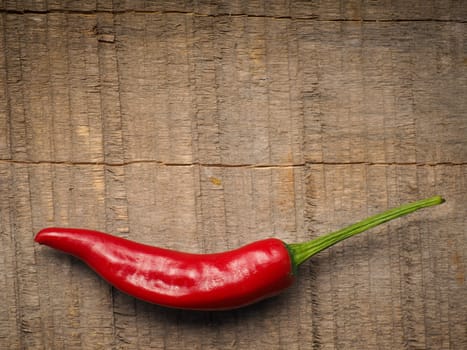 Close up of a red hot pepperoni, spicy ingredients, space for text