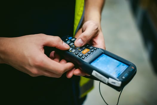Worker Checking and Scanning Package by tablet handheld In Warehouse.