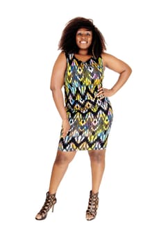 A tall big African American women in a colourful dress standing from the.front, isolated for white background..