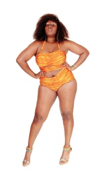 An African American young woman standing from the front in a orange .bikini on the floor, isolated for white background..
